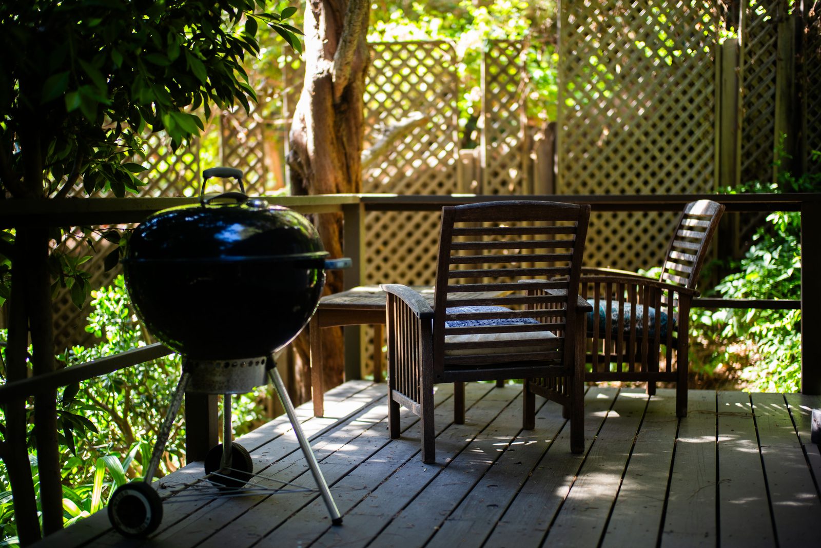 Private deck with Weber grill and teak seating